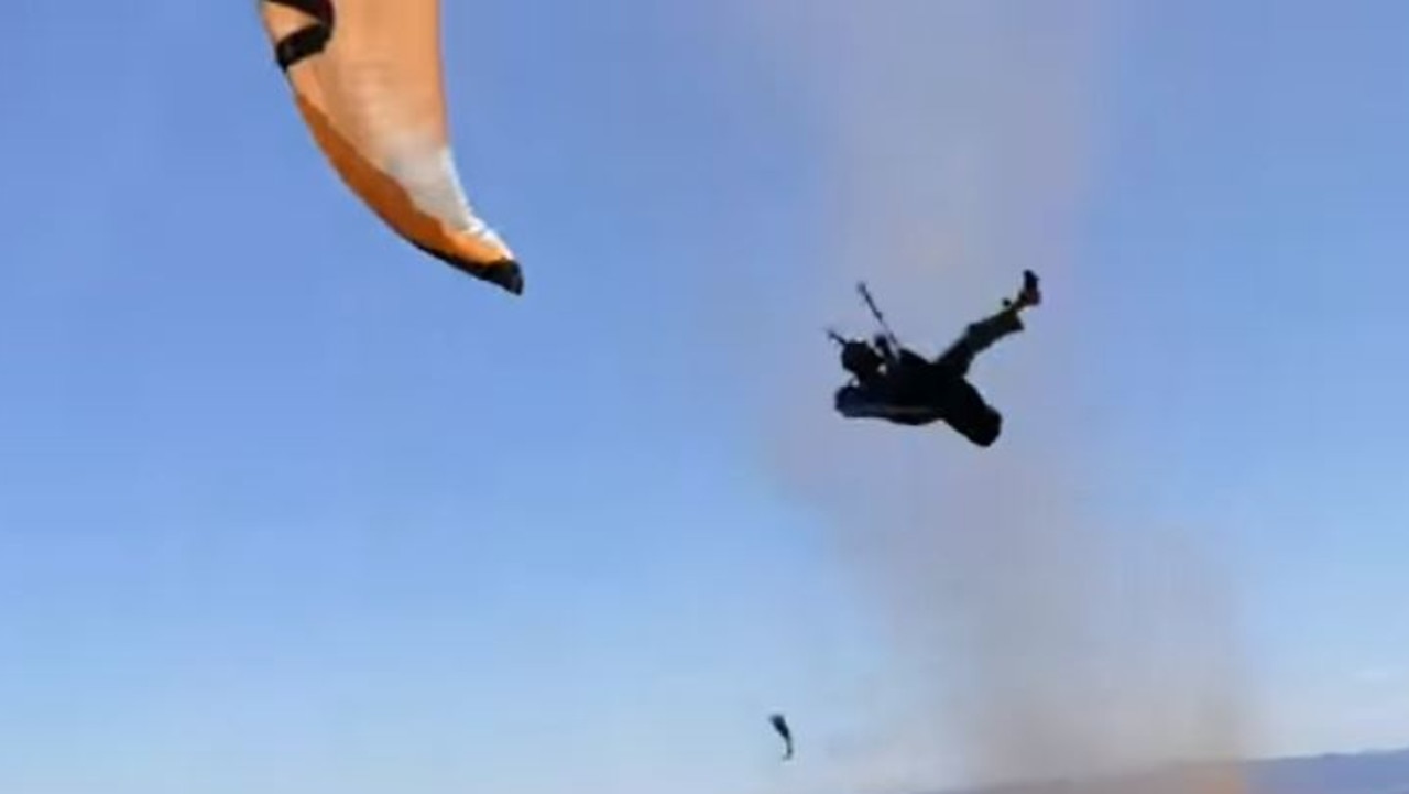 The paraglider is caught by a sudden massive gust which flings him into the air. Source:Youtube screenshot