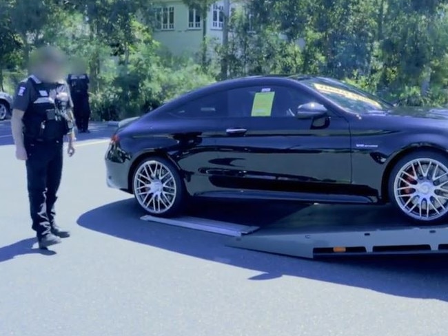 SPER officers pictured seizing a BMW.