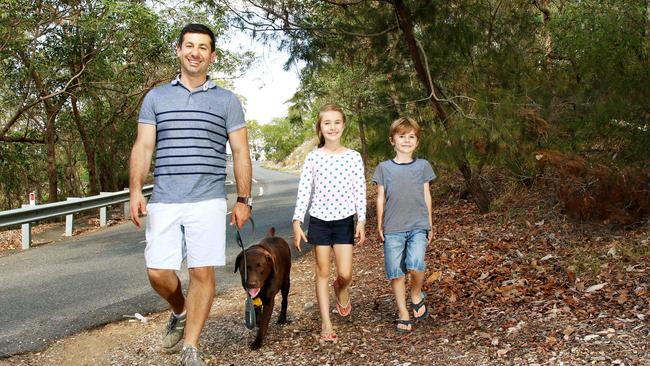 Kids Bianca and Luca help dad Stephen walk Saba the dog. Picture: Peter Cronin