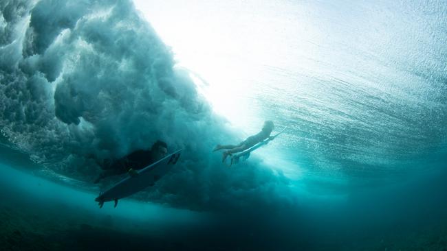 Mark Richardson (left) and son Ty Richardson surfing together. Picture credit: George Harper.