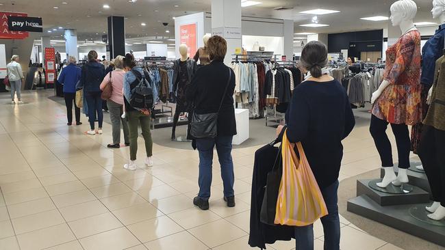 Myer customers queue at check-outs on the first day of instore trade since lockdown.