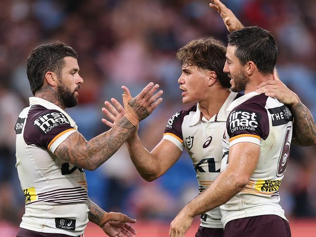 SYDNEY, AUSTRALIA - MARCH 06: AdamÃÂ Reynolds, Ben Hunt and Reece Walsh of the Broncos celebrate winning the round one NRL match between Sydney Roosters and Brisbane Broncos at Allianz Stadium on March 06, 2025, in Sydney, Australia. (Photo by Cameron Spencer/Getty Images)