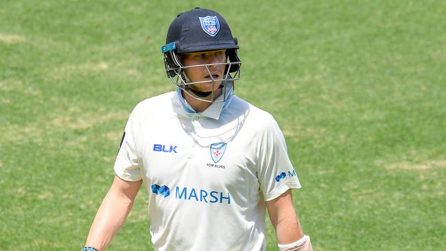 Steve Smith of the Blues walks off the field after being bowled out by Michael Neser of the Bulls during day 4 of the Marsh Sheffield Shield cricket match between the Queensland Bulls and the New South Wales Blues at the Gabba in Brisbane, Sunday, October 13, 2019. (AAP Image/Albert Perez) NO ARCHIVING, EDITORIAL USE ONLY, IMAGES TO BE USED FOR NEWS REPORTING PURPOSES ONLY, NO COMMERCIAL USE WHATSOEVER, NO USE IN BOOKS WITHOUT PRIOR WRITTEN CONSENT FROM AAP