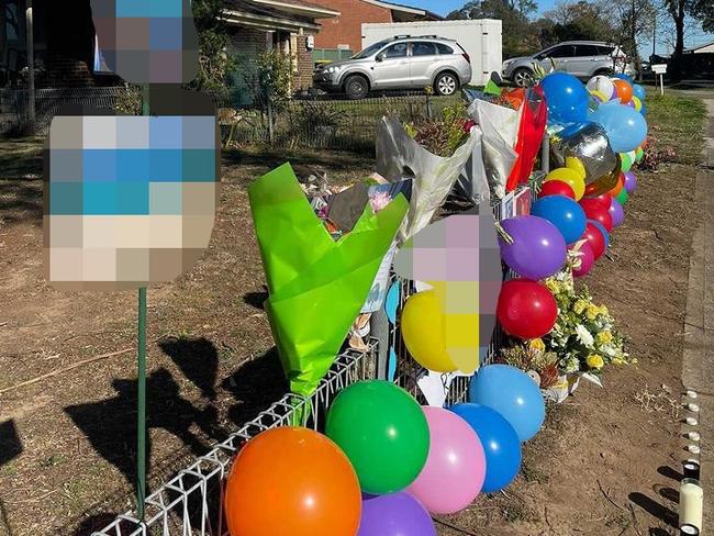 The memorial which has popped up at the home on Friday.