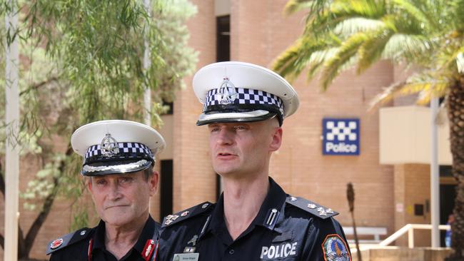 Assistant Commissioner Domestic Violence and Youth Command Michael White and Acting Commander Crime and Intelligence Command Drew Slape address media out the front of Alice Springs police station on Monday, February 10, 2025. Picture: Gera Kazakov