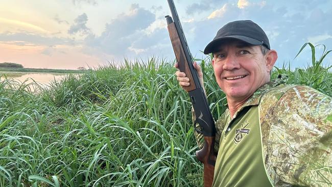 Agriculture and Fisheries Minister Gerard Maley with his gun on a hunting trip.