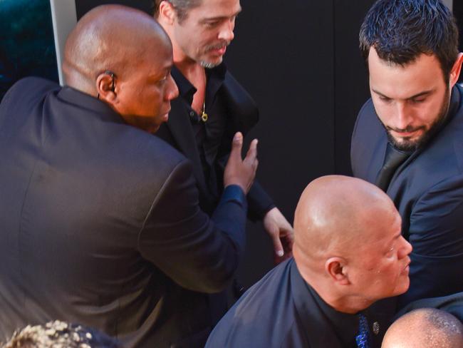 A crazy fan tried to attack Angelina Jolie and Brad Pitt on the red carpet.