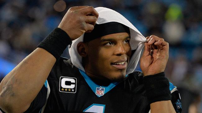 CHARLOTTE, NC - JANUARY 03: Cam Newton #1 of the Carolina Panthers watches from the sideline during the final minute of their game against the Tampa Bay Buccaneers at Bank of America Stadium on January 3, 2016 in Charlotte, North Carolina. The Panthers won 38-10 to clinch home field advantage for the playoffs. Grant Halverson/Getty Images/AFP == FOR NEWSPAPERS, INTERNET, TELCOS & TELEVISION USE ONLY ==