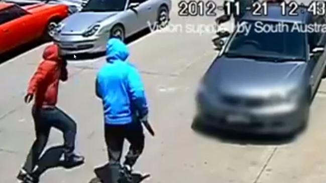 CCTV captures hooded men outside Jason De Ieso’s panel beating workshop in Pooraka in 2012. Picture: SA Police