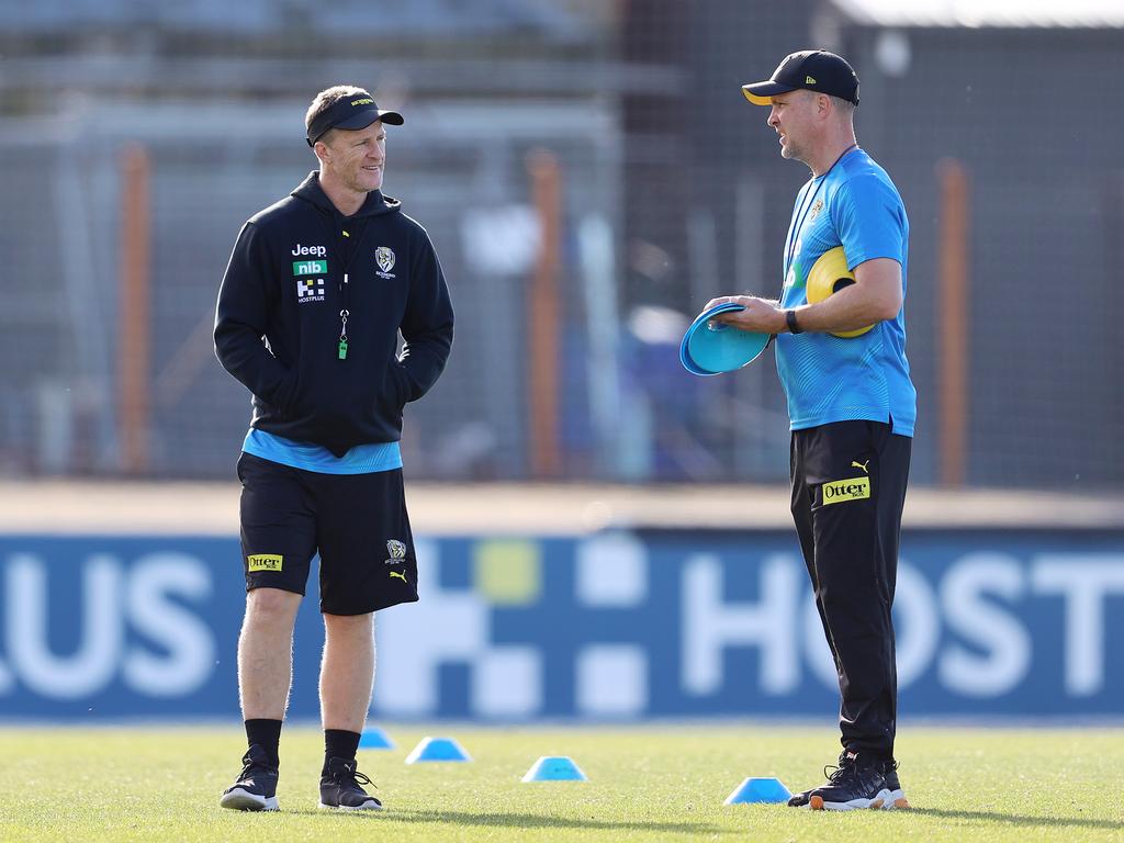 Richmond coach Damien Hardwick speaks with the club’s physical performance manager, Peter Burge. Picture: Michael Klein