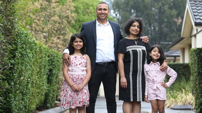 Mukesh Kumar with his wife Shilpi and daughters Misha, 9, and Prisha, 6, at their home in Sydney’s west. Picture: Britta Campion