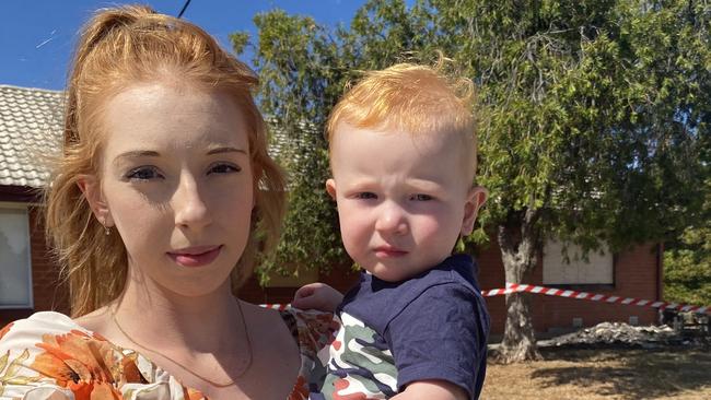 Annalise Madigan and son Blake stand in front of their home which was adjoined to the property that Mead set alight. Picture: Todd Lewis