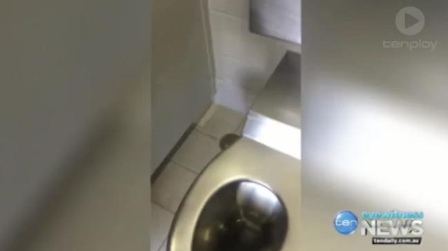 Woman catches man filming her in public toilet