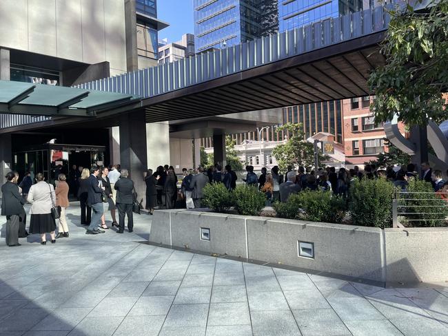 People outside the Brisbane Magistrate's Court on Friday morning after it was evacuated. Picture: Nicola McNamara