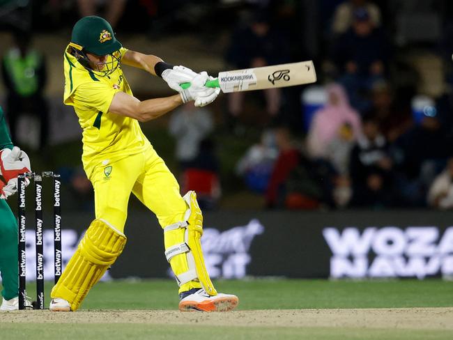 Australia's Marnus Labuschagne (R) plays a shot as South Africa's wicketkeeper Quinton de Kock (L) reacts during the first one-day international (ODI) cricket match between South Africa and Australia at the Mangaung Oval in Bloemfontein on September 7, 2023. (Photo by PHILL MAGAKOE / AFP)