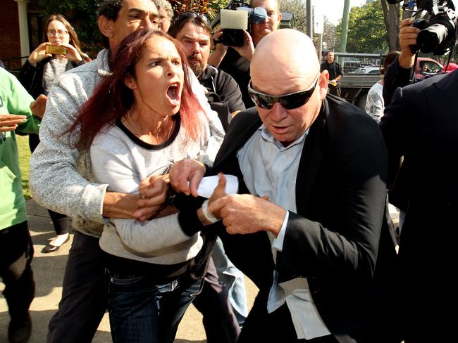 Adrian Attwater is attacked by family and friends of Lynette Daley as he leaves court last year. Picture: Nathan Edwards