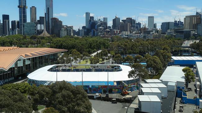 The finishing touches take place on a new shade roof on Show Court 3 for the upcoming Australian Open. Picture: Ian Currie