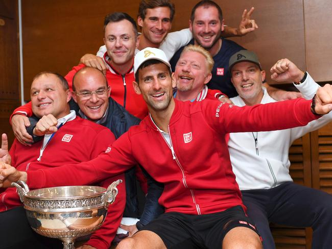 Novak Djokovic celebrates his 2016 French Open triumph with his team — including coach Boris Becker. Picture: AFP