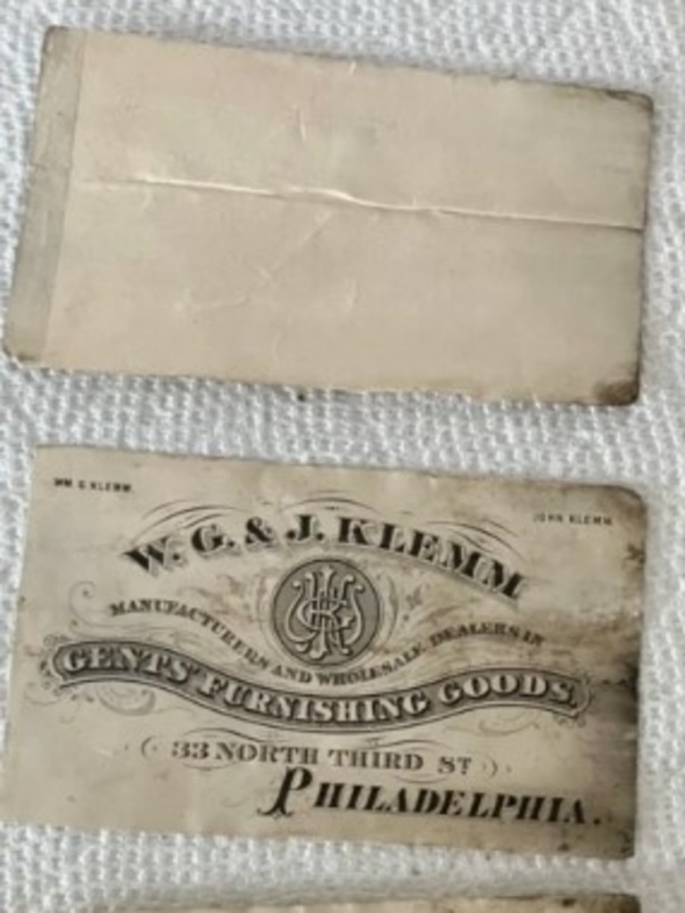 One of the papers in the bottle appears to be a business card from 1876. Picture: TikTok / @asmythco