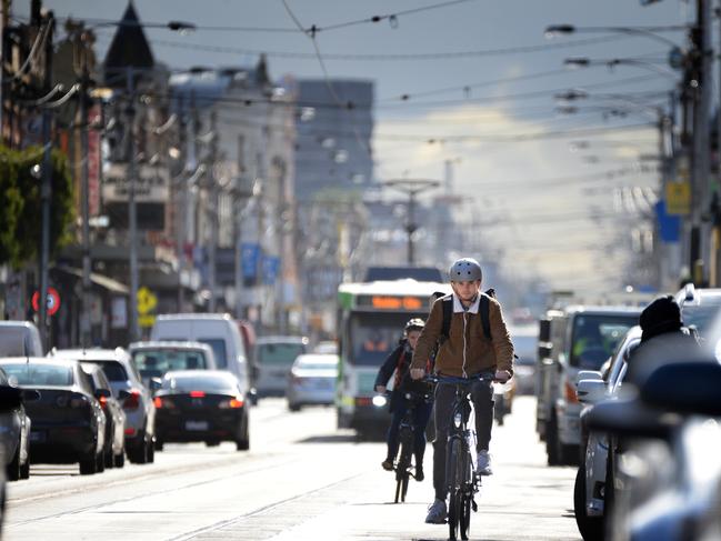 Cyclists travelling south along Sydney Rd Brunswick (between Glenlyon and Brunswick Roads). A proposal could see a dedicated bike lane along the busy commercial and retail strip. Picture: Andrew Henshaw