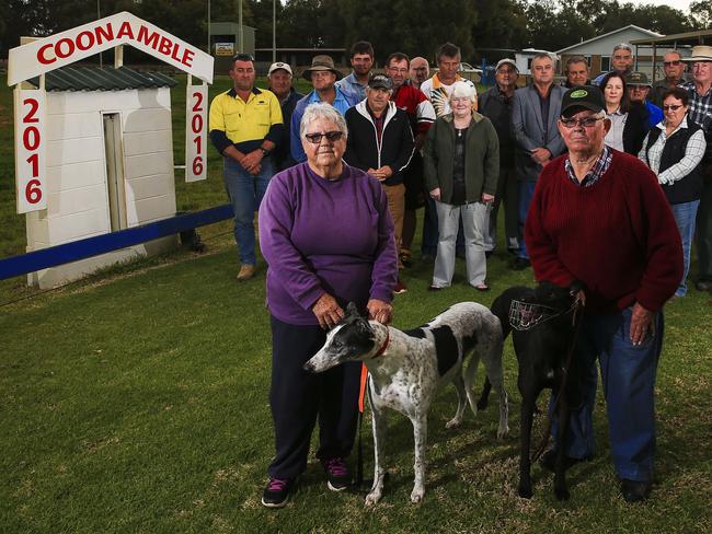 Coonamble locals stand on their the Greyhound track opposing Mike Baird's decision to ban racing Picture: Dylan Robinson