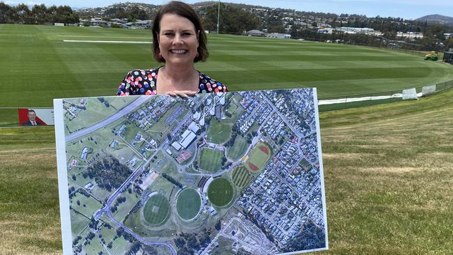 Kingborough Mayor Paula Wriedt with an aerial view of an expanded Twi Ovals precinct to accommodate an AFL High Performance Centre. Picture James Bresnehan.jpg