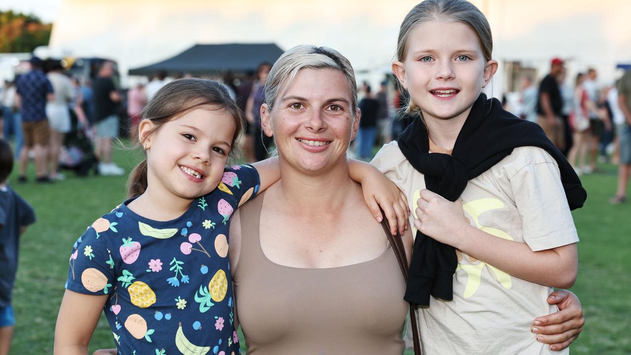 Aria Pezzutti, 5, Sophie Pezzutti and Briella Pezzutti, 10, at the Barron River Food Festival, held at the Stratford Dolphins Football Club. Picture: Brendan Radke