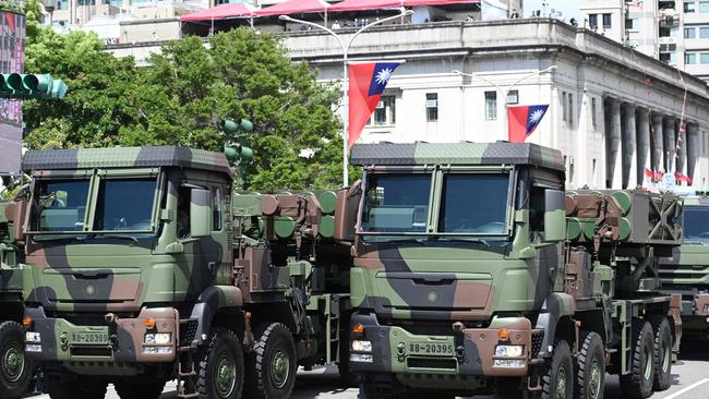 Taiwanese military vehicles take part in a national day parade in front of the Presidential Palace this month. Picture: AFP