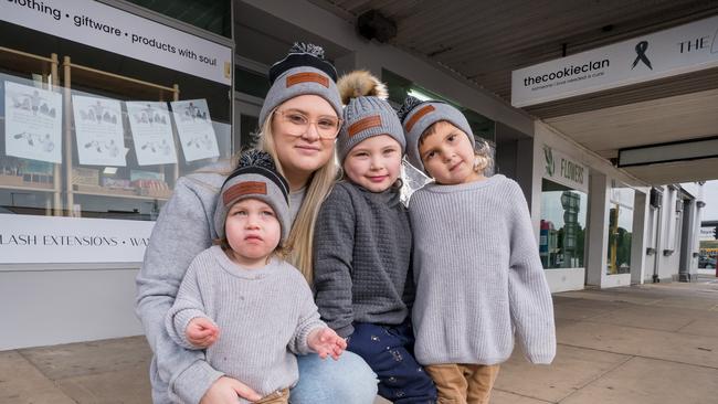 Chloe Cook with her kids, Ava (5), Chaz (3) and Reed (1) with the small business that she runs in Colac by herself after her husband died in December. Picture Jay Town