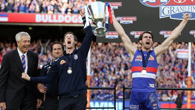 Bob Murphy and Easton Wood hoist the premiership cup as John Schultz and Luke Beveridge watch on. Picture: Michel Klein