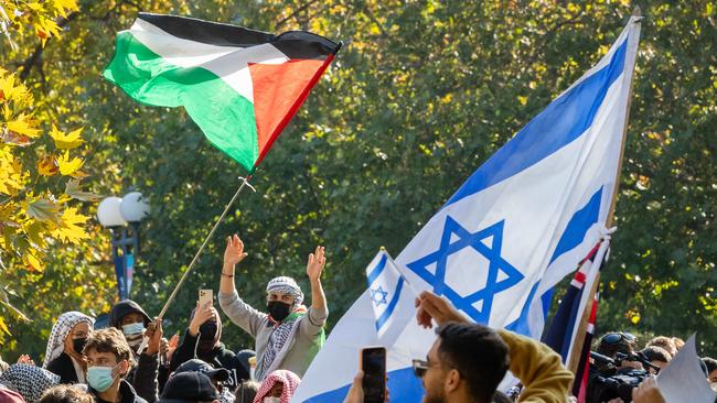 Jewish Israel supporters gather in a park near Melbourne University then walk into the university and face off with Pro Palestine protesters. Picture: Jason Edwards