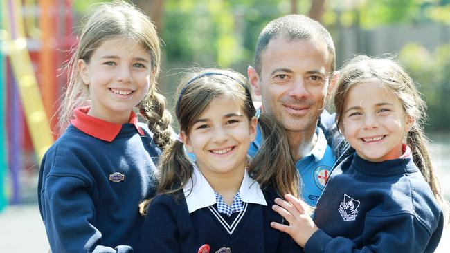 Walk to School month, featuring former professional soccer player and now Melbourne City assistant coach Ivan Jolic and his three daughters Ivanka, Alannah, and Mia. Picture: Janine Eastgate