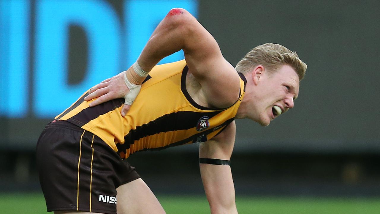 Hawthorn’s James Sicily was struck by Geelong’s Tom Hawkins. Picture: Michael Klein