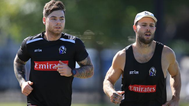 Jamie Elliott and Brent Macaffer run laps at Collingwood training. Picture: Wayne Ludbey
