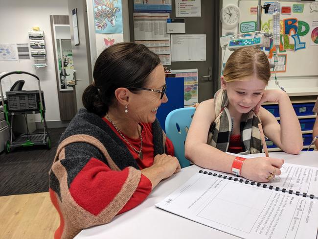 Teacher Alison Schubert with pupil Zara Toms at the school classroom in Gold Coast University Hospital. Picture: Keith Woods.