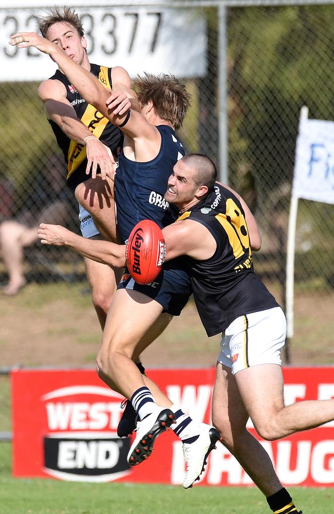 Glenelg's Alex Martini and James Sellar crunch the pack. Picture Roger Wyman