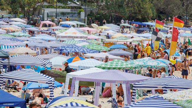 ‘Fie! Vulgarian. Queenslander.’ Crowds pack in to Noosa Main Beach on the New Years Day public holiday. Picture Lachie Millard