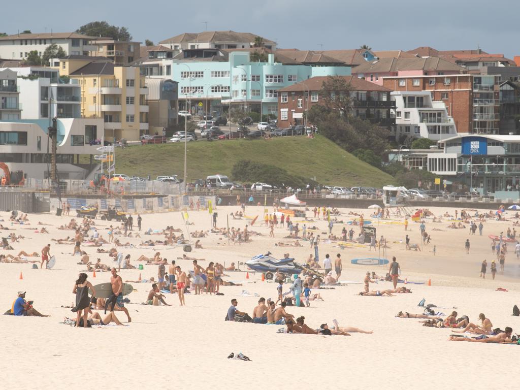 Beachgoers drew condemnation on Friday when tens of thousands of people flouted social distancing rules, which have been put in place in an effort to limit the spread of COVID-19. Picture: AAP Image/James Gourley