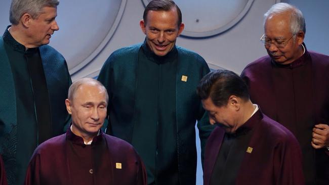 Prime Minister Tony Abbott with APEC Leaders including Russian President Vladimir Putin and Chinese President Xi Jinping for the family photo at the Water Cube in Beijing, China in September 2014. Pool Photo: Andrew Meares