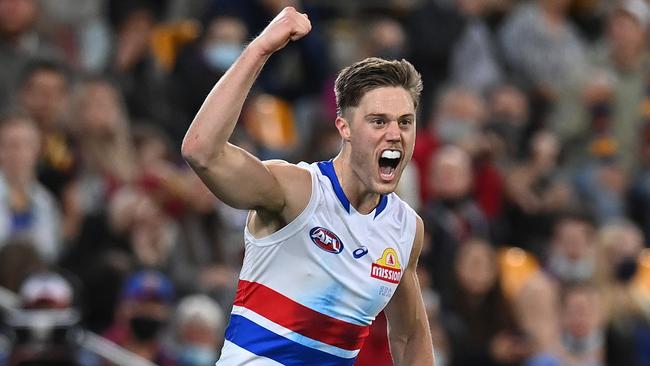 Josh Schache celebrates a goal as the Doggies keep coming against the Lions.