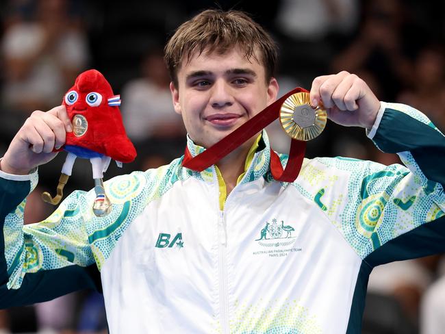 NANTERRE, FRANCE - SEPTEMBER 06: Gold medallist Callum Simpson of Team Australia poses for a photo on the podium during the Para Swimming Men's 100m Freestyle S8 medal ceremony on day nine of the Paris 2024 Summer Paralympic Games at Paris La Defense Arena on September 06, 2024 in Nanterre, France. (Photo by Sean M. Haffey/Getty Images)