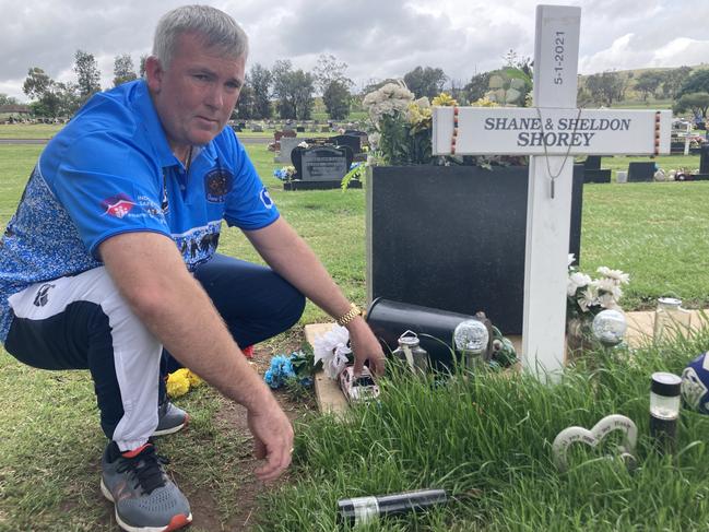 Joseph Shorey at the grave of his two young sons Shane and Sheldon, who were killed in Wellington in January 2021. Picture: Ryan Young