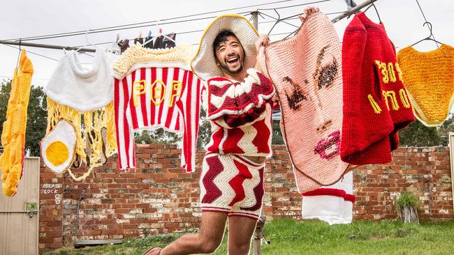 Extreme crochet artist Phil Ferguson does the washing in one of his creations — the Bacon and Egg hat. Picture: Tim Carrafa