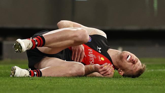 AFL Round15 . Essendon vs Melbourne at MCG, Melbourne. 26/06/2021.  Nick Hind of the Bombers after getting pushed into the behind post during the 3rd qtr.     .  Pic: Michael Klein