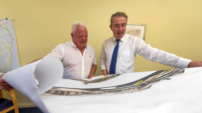 CEO of Signature Care Graham Croft looks over plans of previously built aged care homes with Member for Page Kevin Hogan. Picture: Adam Hourigan