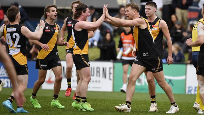 Lachie Wilson and Tom Keys celebrate a goal for Heidelberg. Picture: Andrew Batsch