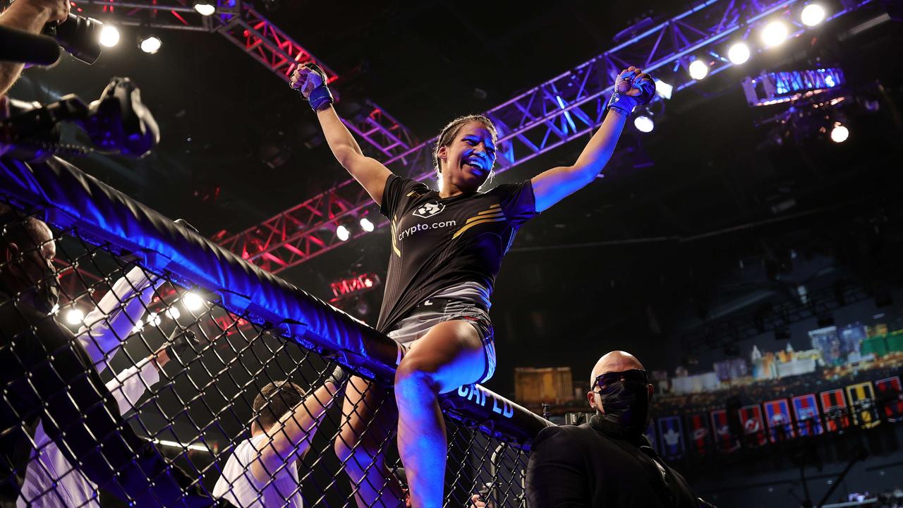 Julianna Pena celebrates after defeating Amanda Nunes of Brazil to win the women's bantamweight title during the UFC 269 event.