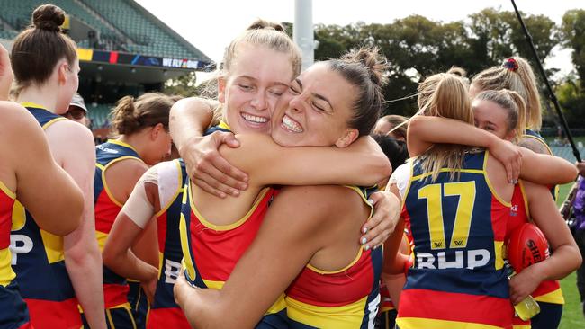 Teah Charlton of the Crows and Ebony Marinoff hug after the Crows stormed into the grand final. Picture: Sarah Reed/AFL Photos via Getty Images