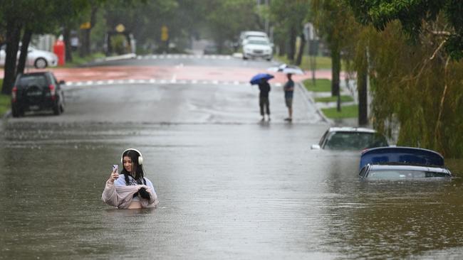 A flooded street in the suburb of Newmarket, Brisbane. Picture: Albert Perez/Getty Images