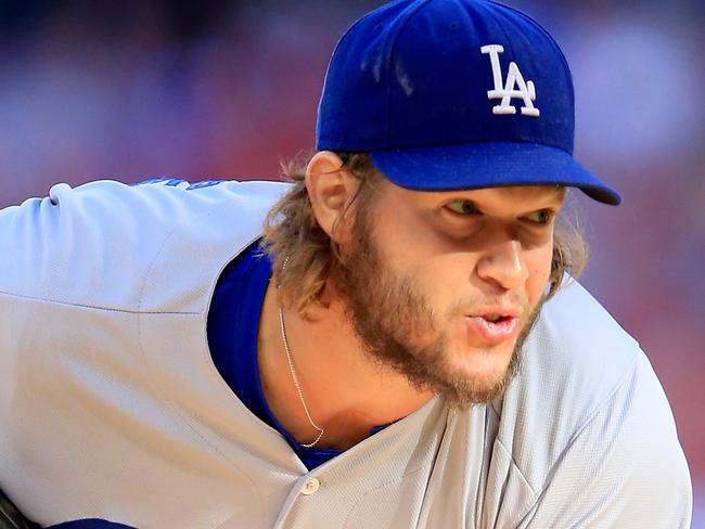 FILE - Los Angeles Dodgers ace pitcher Clayton Kershaw was named the National League's Cy Young Award winner for the third time in his career November 12, 2014. ST LOUIS, MO - OCTOBER 07: Clayton Kershaw #22 of the Los Angeles Dodgers pitches in the first inning against the St. Louis Cardinals in Game Four of the National League Divison Series at Busch Stadium on October 7, 2014 in St Louis, Missouri. (Photo by Jamie Squire/Getty Images)